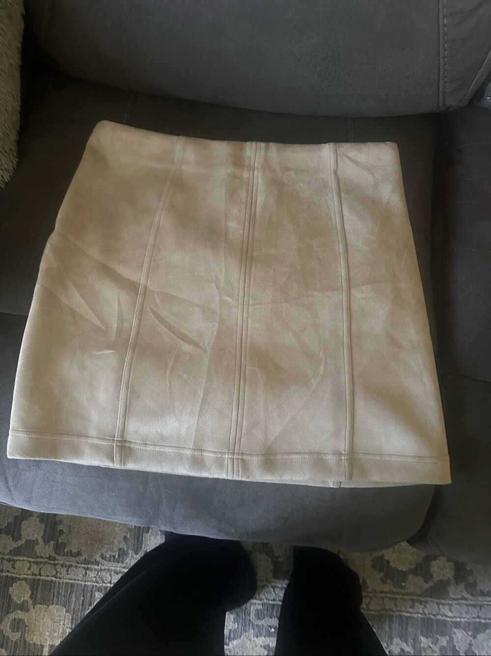 Fashion Nova cream-colored faux-suede mini skirt features stylish vertical panel